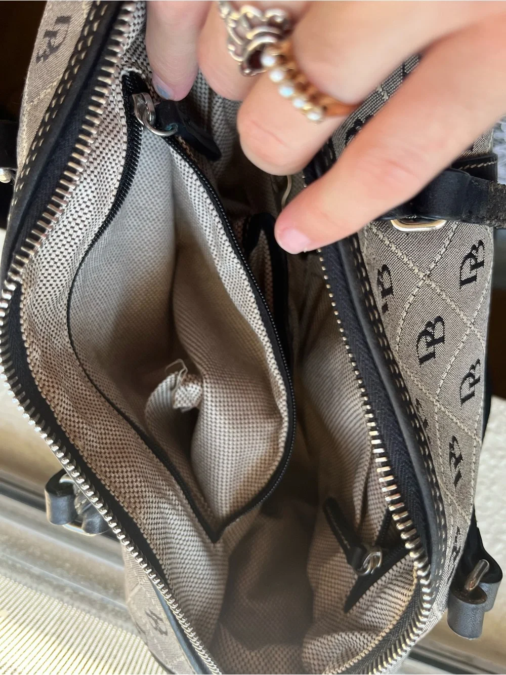 Dooney & Bourke Beige and Black Monogram Barrel Bag with Charm